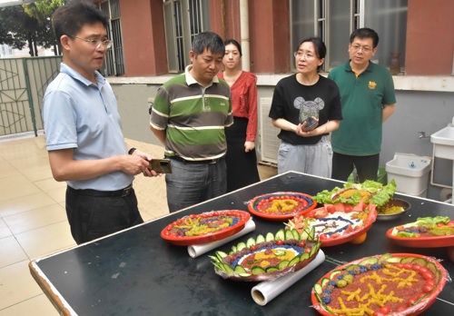 成人教育学院举办“五彩三月三 共拼成教美”主题活动